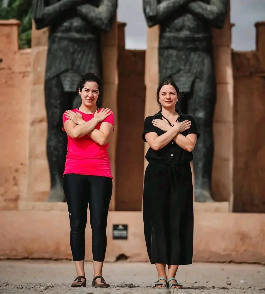 Two girls enjoy visiting the largest movie studio in Morocco during their Marrakech Sahara Desert tour.