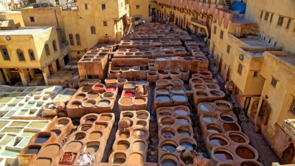 The traditional Chouara Tannery in Fez, Morocco, with stone vats filled with colorful dyes a standout destination on a one week Morocco itinerary with a local guide
