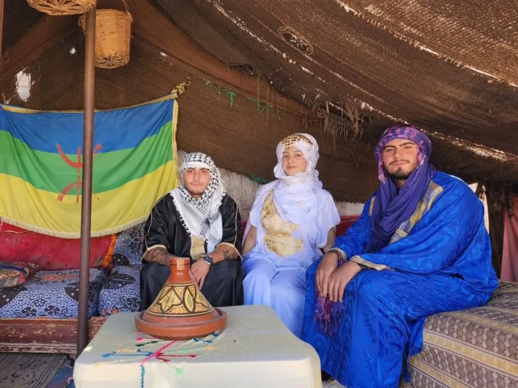 A traditional Berber nomad tent made of woven goat hair, a highlight of authentic Fes to Marrakech desert tours.
